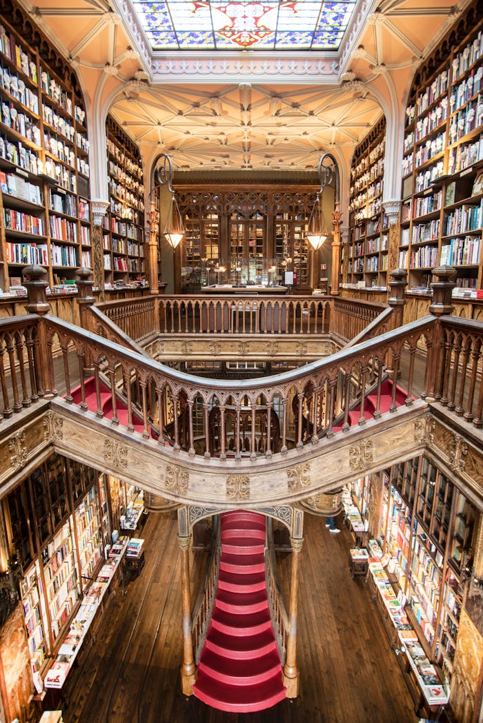 Stunning view of the iconic Livraria Lellos grand staircase and bookshelves in Porto, Portugal.